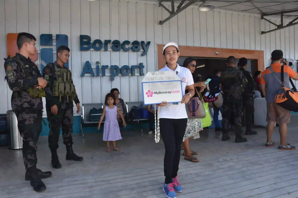 Airport welcome Girl at the exit of the arrival lobby