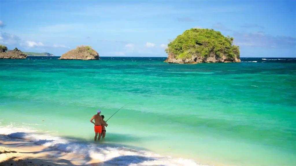 couple enjoying the sunny weather at Ilig-Iligan Beach