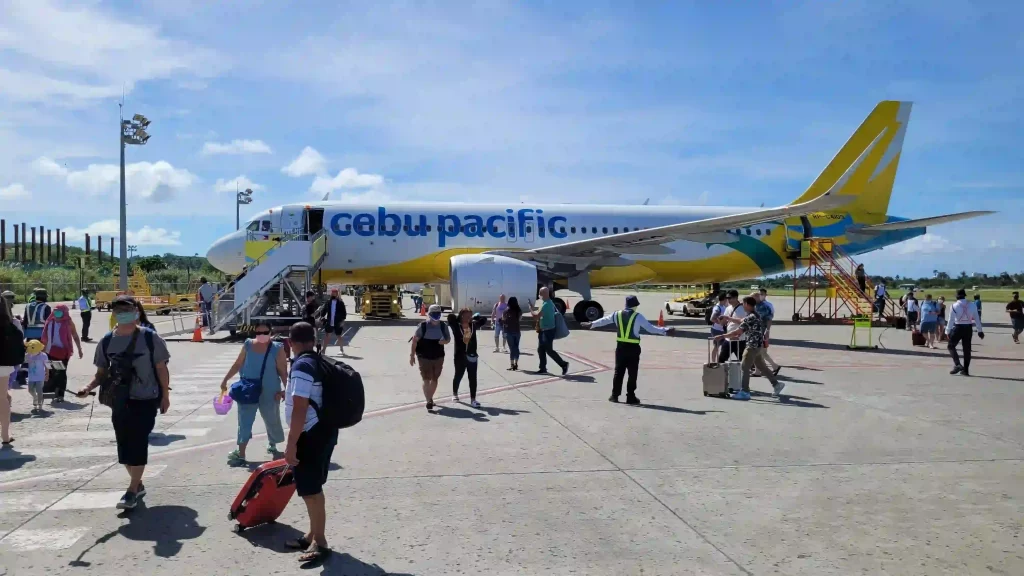 tourists disembarking airplane at Caticlan Airport