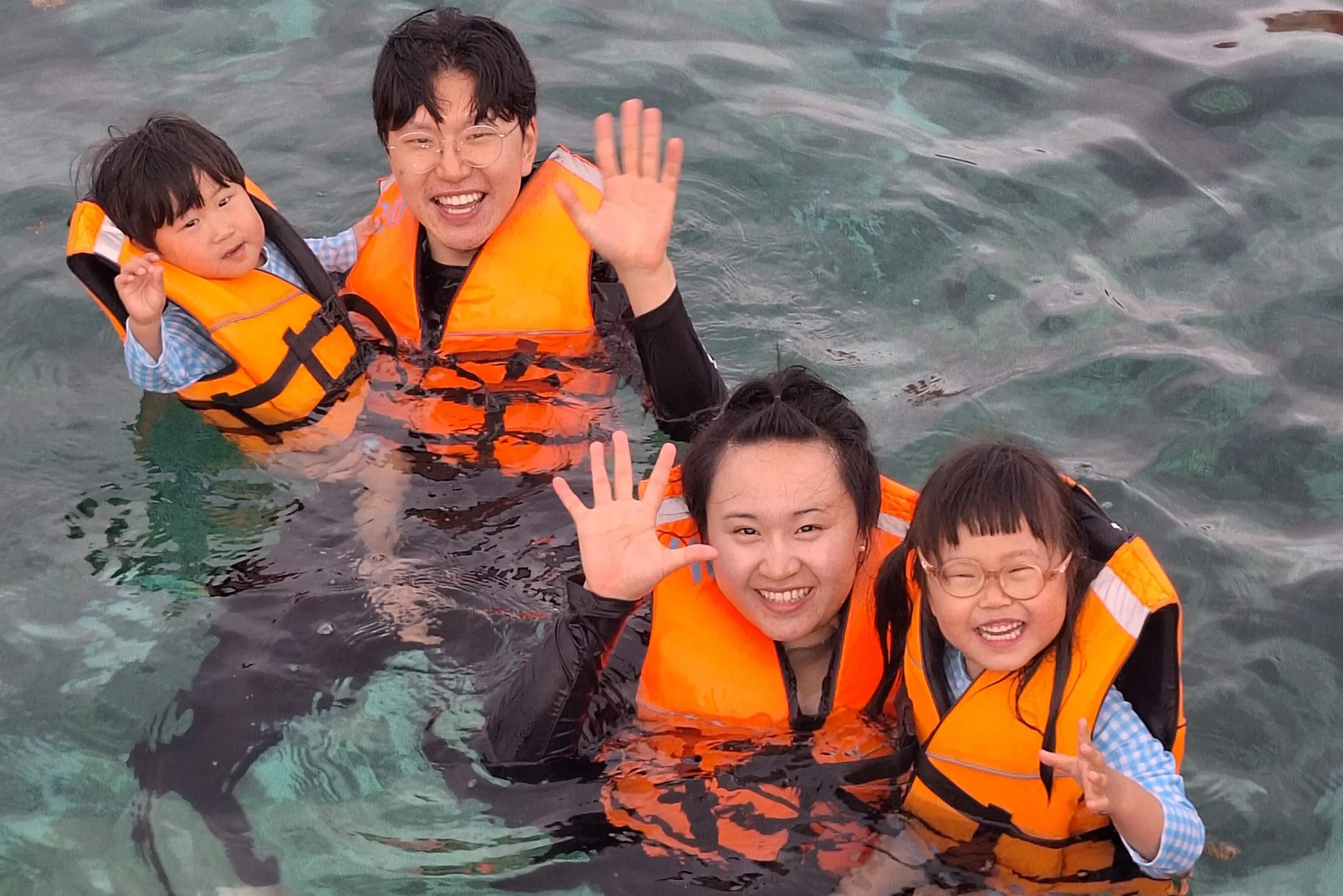 kids having fun in sunset cruise with their parents