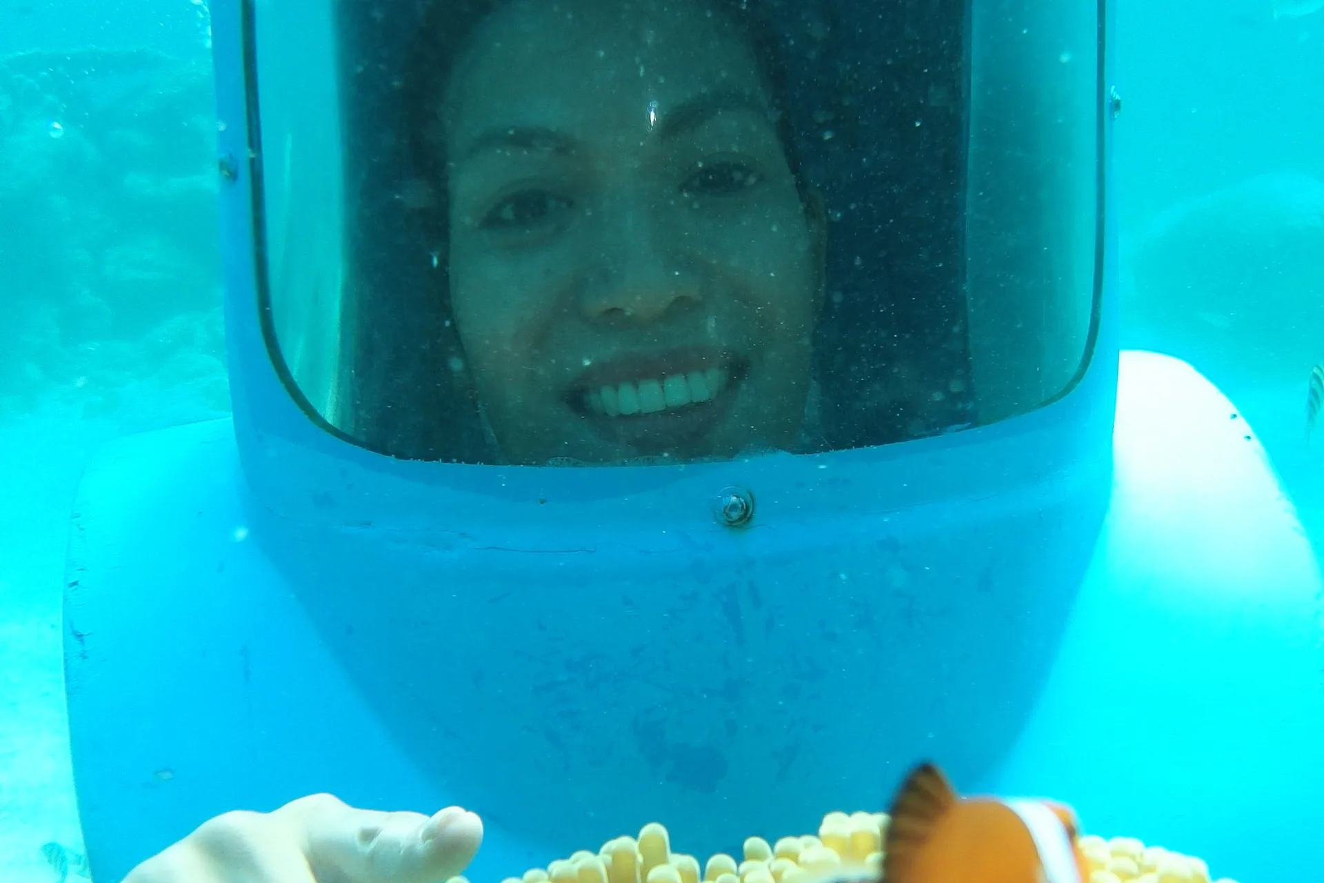 Tourist walking on the seabed during helmet diving in Boracay