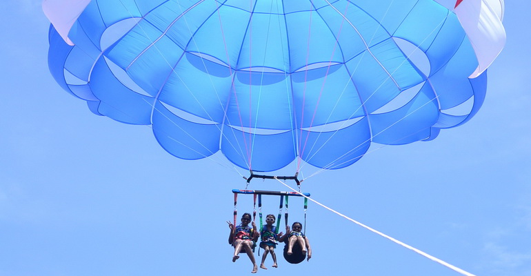 Parasailing high above the turquoise waters of White Beach Boracay