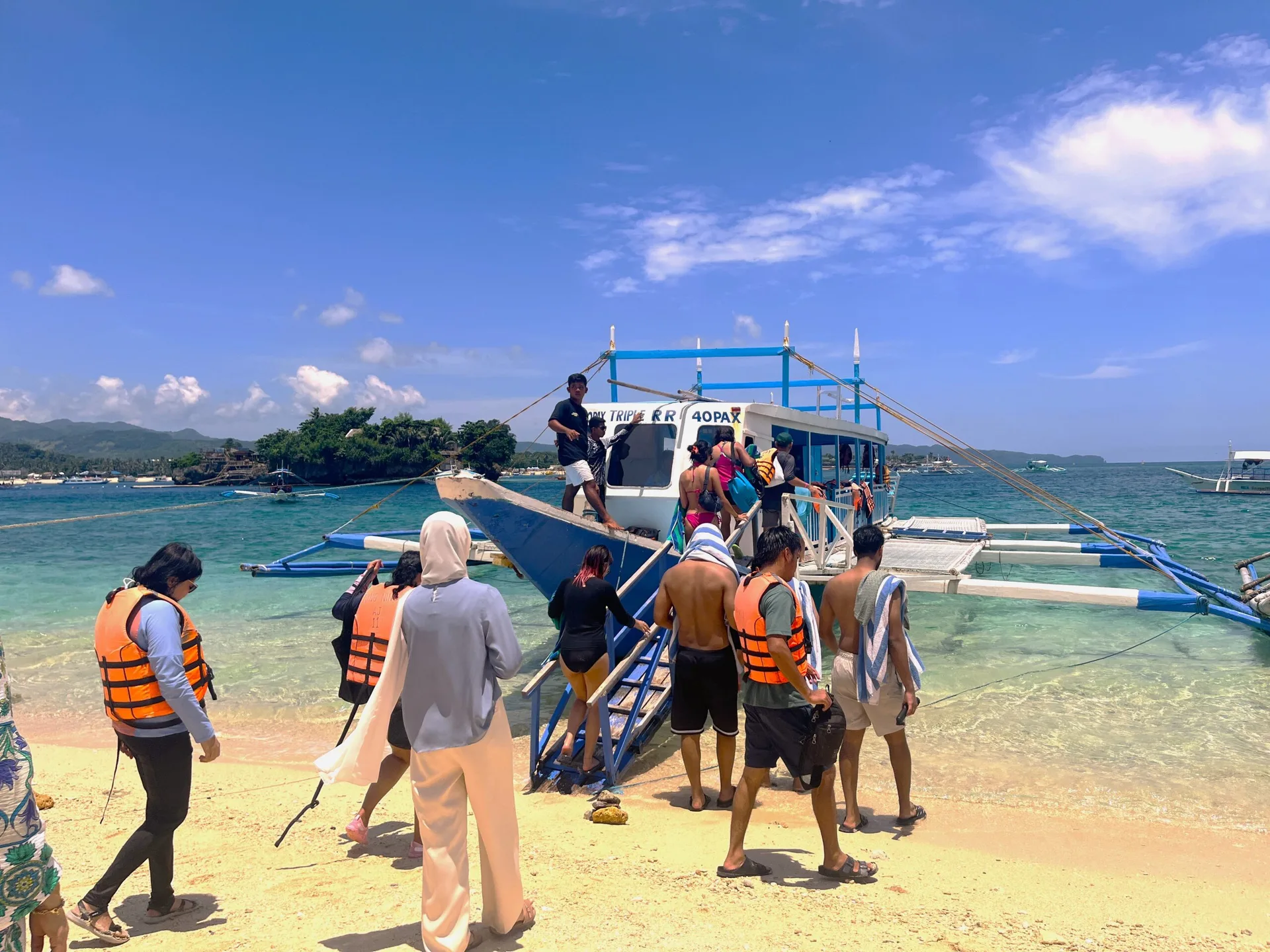 Island hopping boat approaching Crystal Cove Island near Boracay