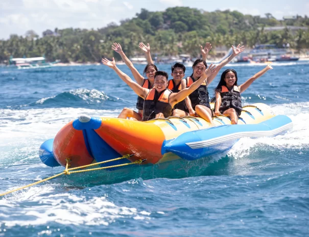 group of friends enjoying a banana boat ride